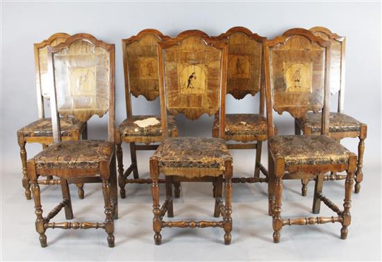 A set of seven early 18th century Italian walnut dining chairs, W.1ft 5in. H.3ft 10in.